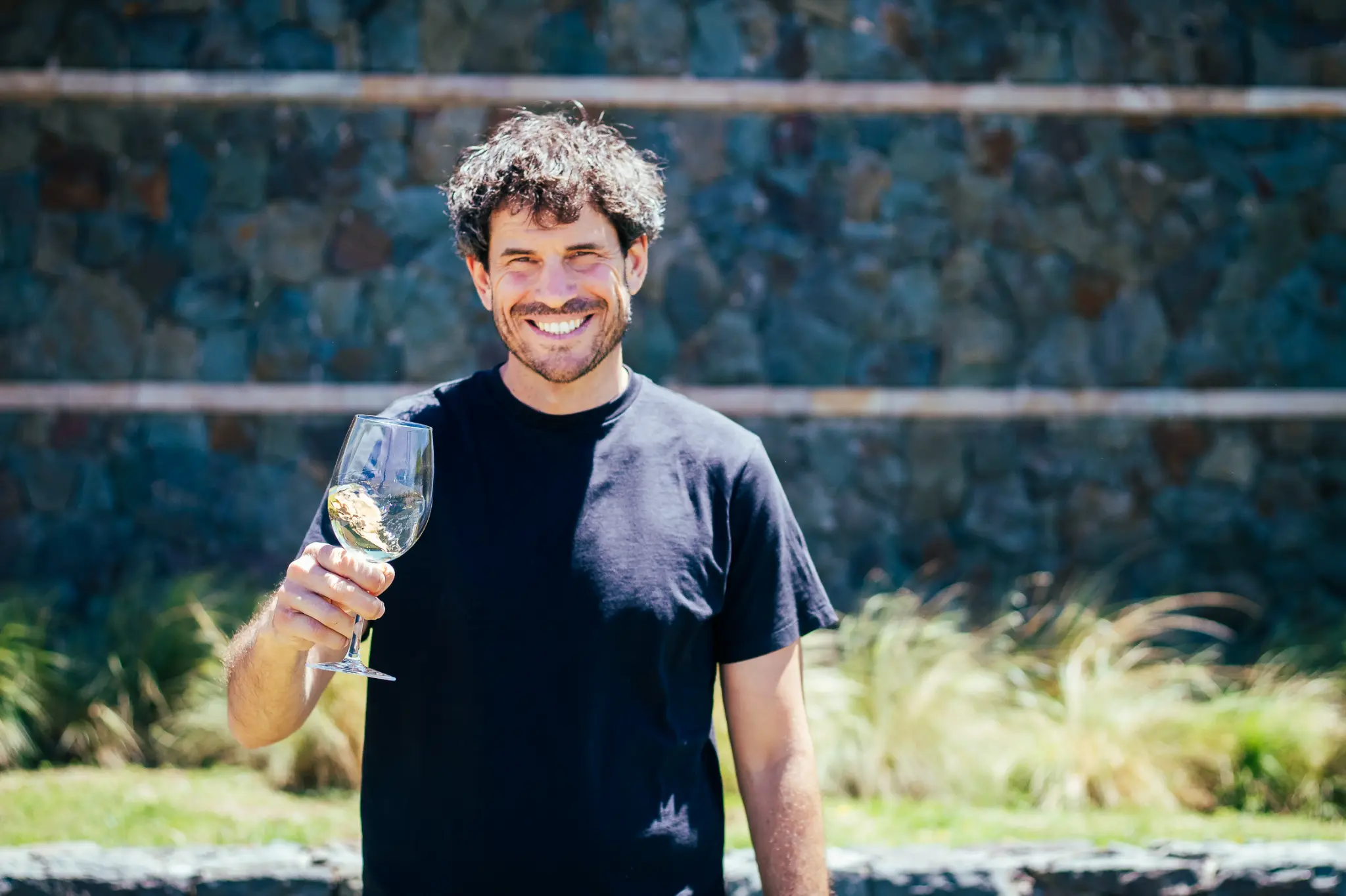 Bodega Caelum winemaker holding a wine glass
